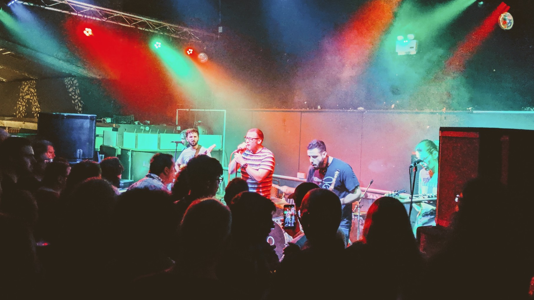 Five members of Thank You Scientist performing on stage under lights at Alberts in Nottingham